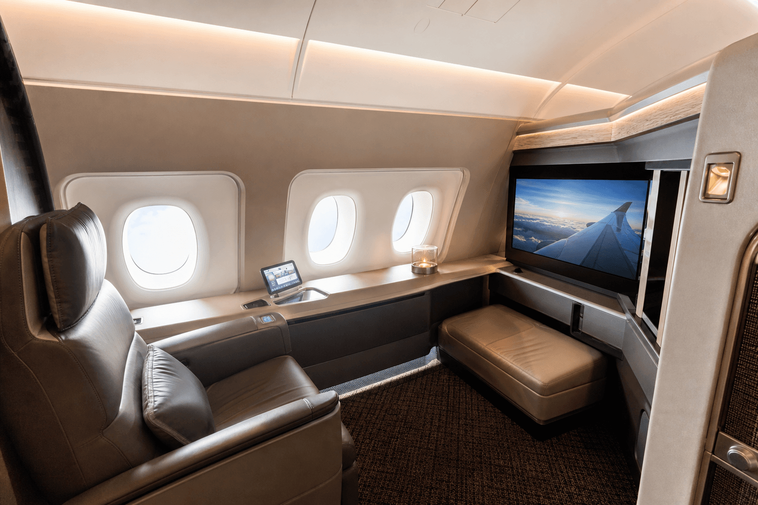 Luxurious airline first class suite with plush seating and ambient lighting