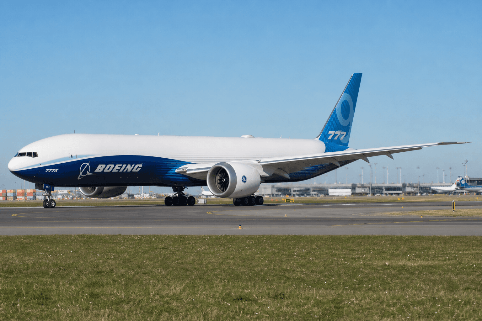 Boeing 777-8F freighter taxiing on airport runway at daytime