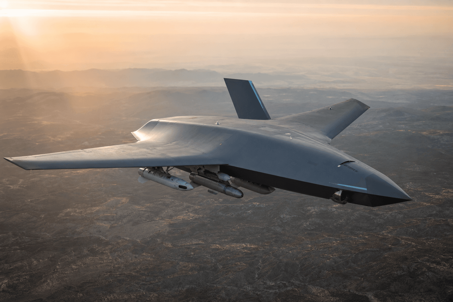 MQ-28 drone flying over a test range showcasing extended wingspan