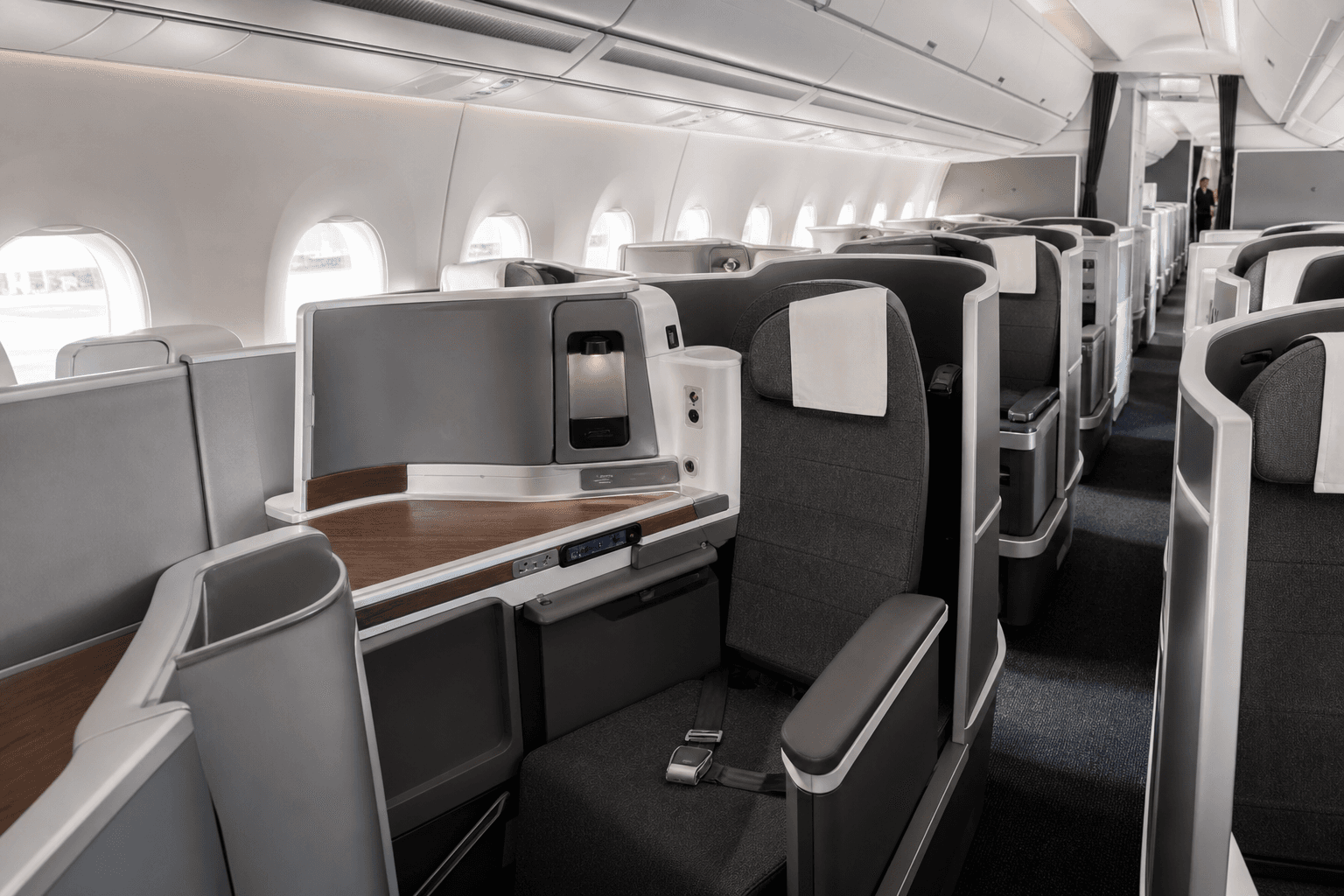 Airbus A350 aircraft interior showing premium business class cabin with lie-flat seats and spacious layout