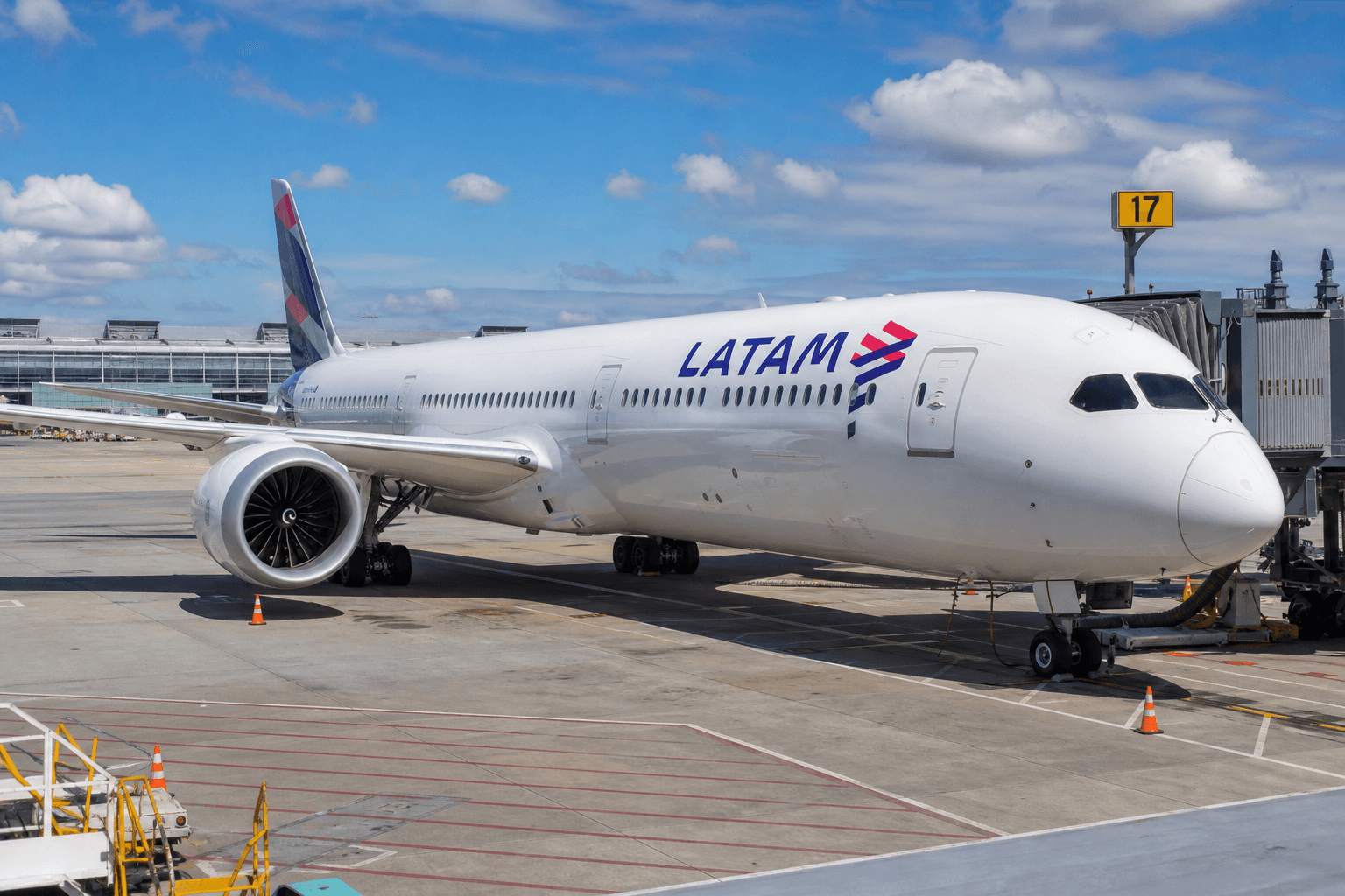 LATAM Boeing 787 aircraft taxiing at an airport during daylight