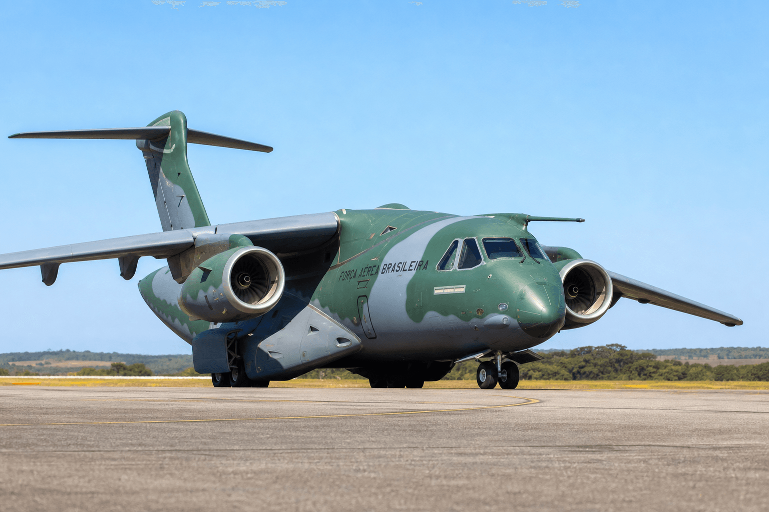Embraer C-390 Millennium military transport aircraft parked on a tarmac under daylight