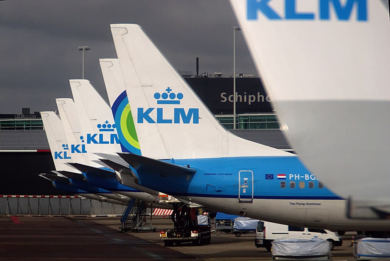 A KLM Boeing 787 taxiing at a European airport on a clear day