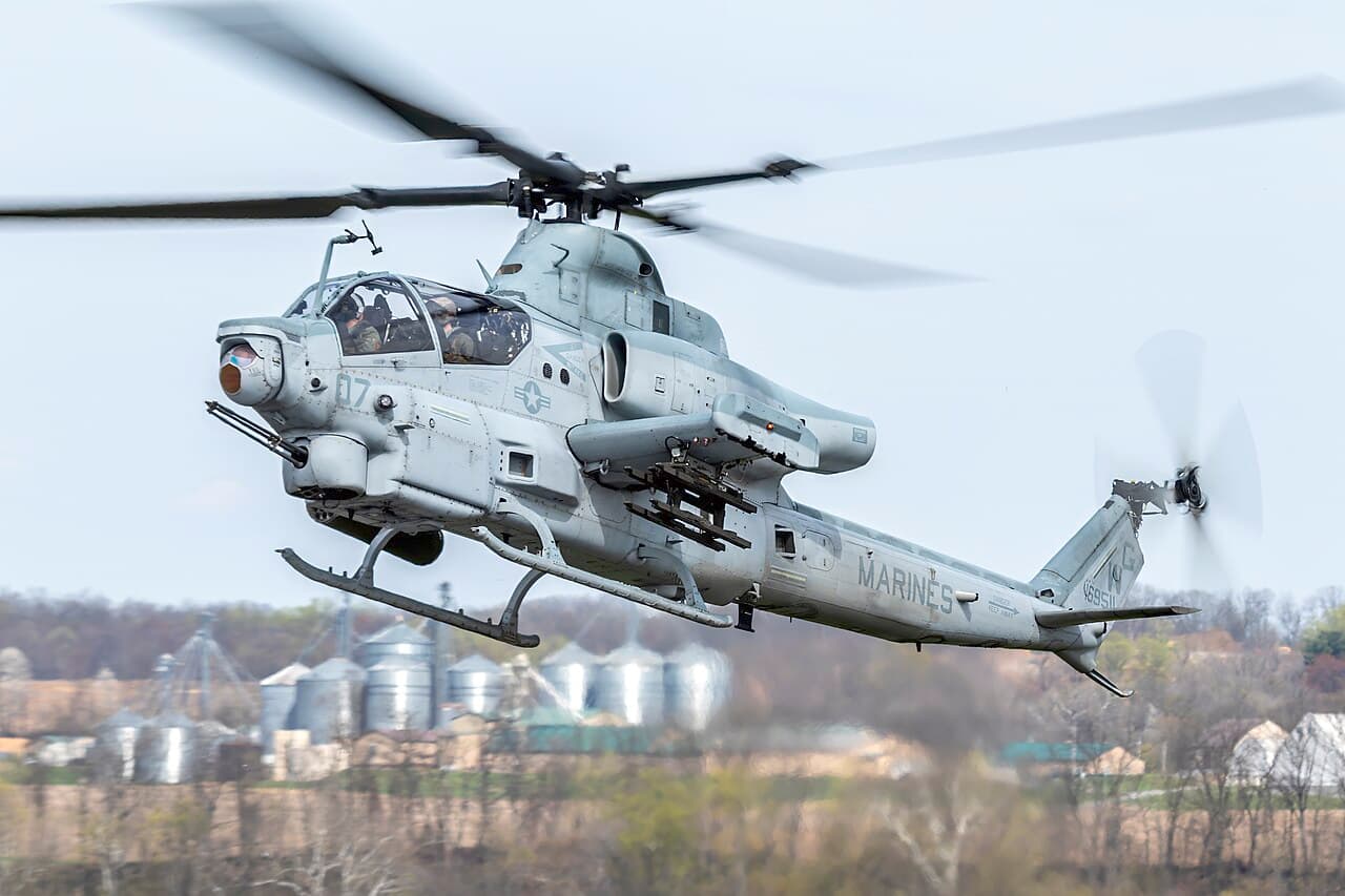 AH-1Z Viper and UH-1Y Venom helicopters on a Marine Corps airfield ready for upgrade work