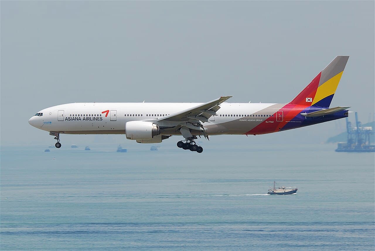 Boeing 777-8F freighter taxiing on airport runway at daytime