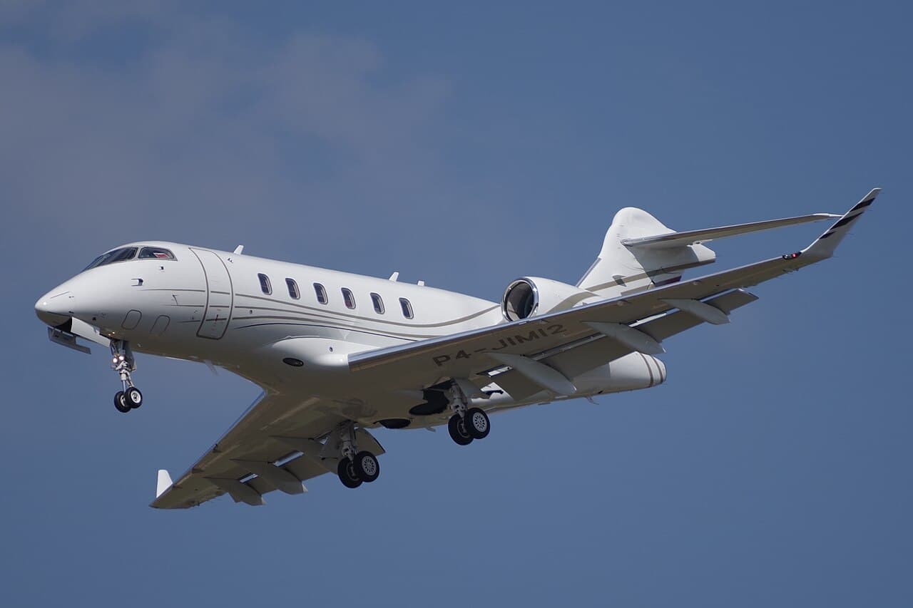 Bombardier Challenger 3500 business jet on taxiway with clear sky background