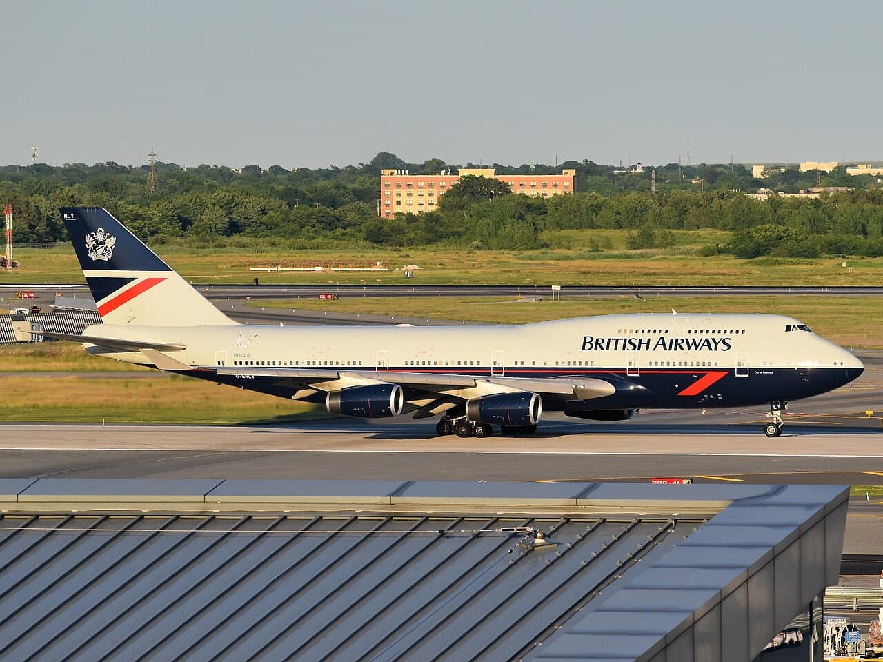 Exterior view of Olympia event center in London with British Airways ARC signage at dusk