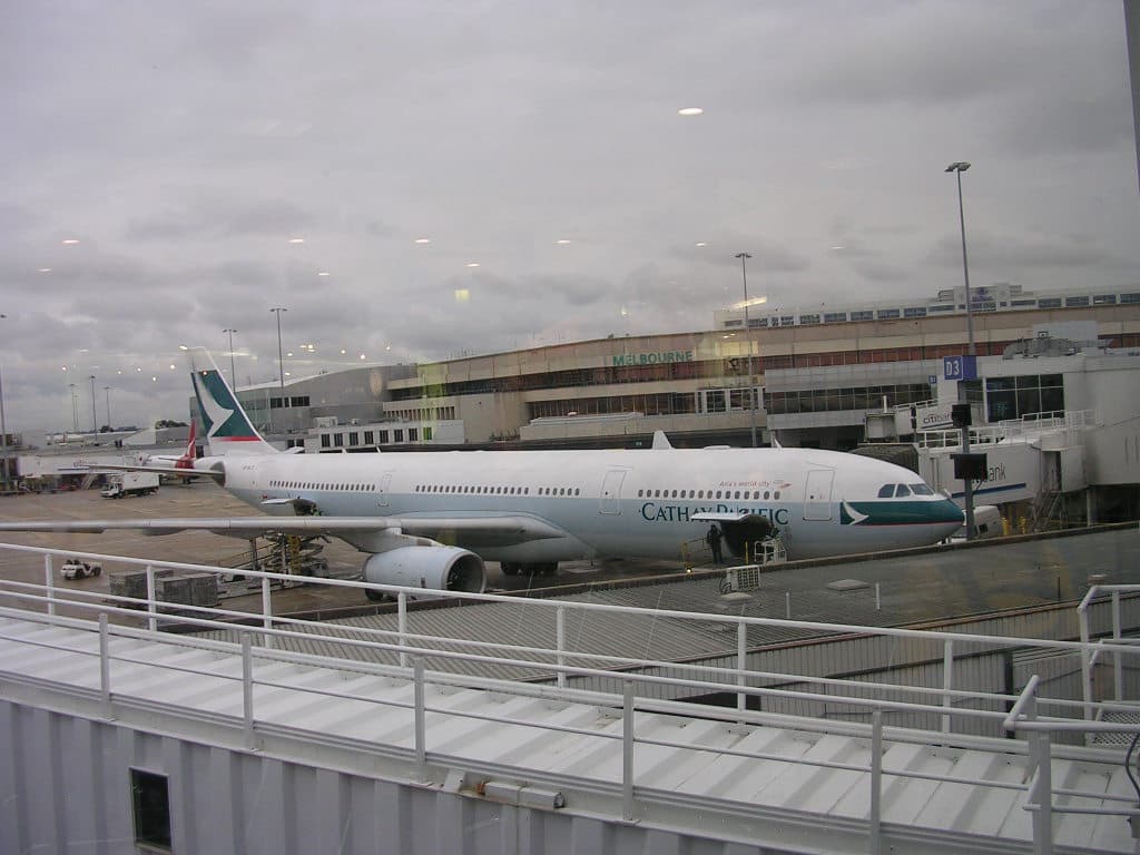 Cathay Pacific aircraft at Hong Kong airport preparing for departure during the day
