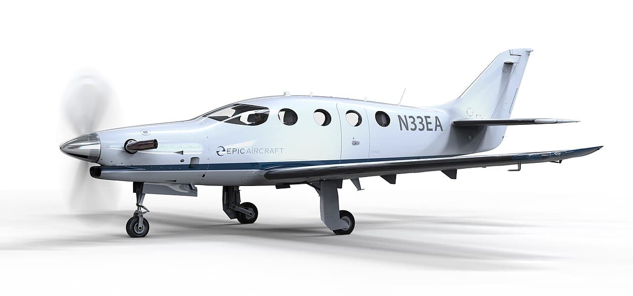 Epic E1000 turboprop on final approach at a mountain airport at night under instrument conditions