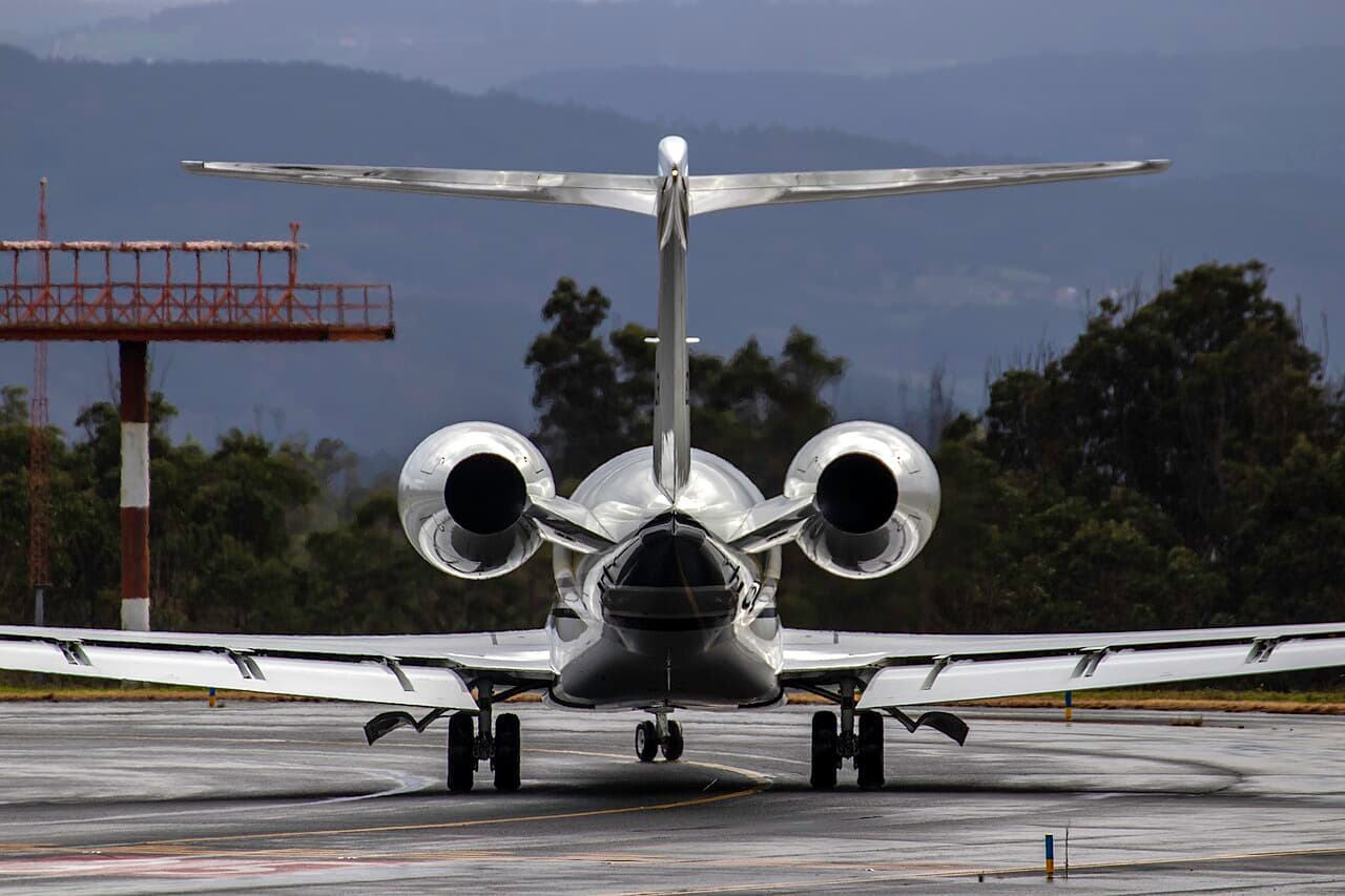 Gulfstream G800 business jet flying against a clear blue sky