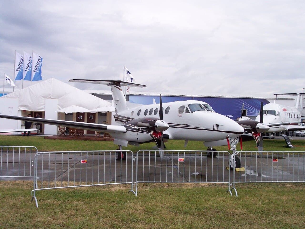 Beechcraft B200 Super King Air climbing steeply after takeoff at Southend Airport