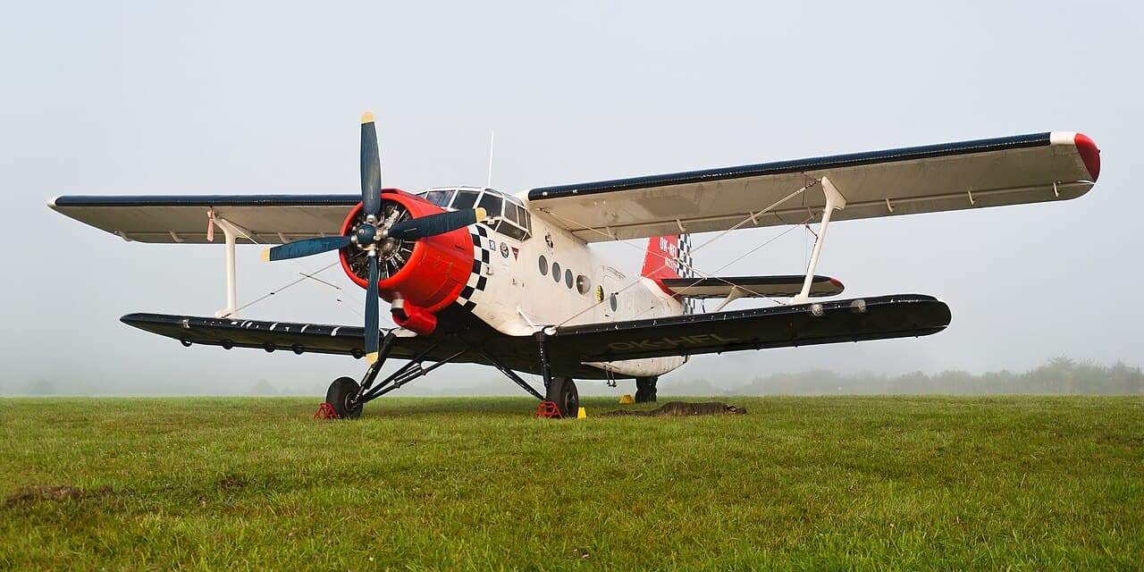 Turboprop aircraft on runway during engine test at an aviation facility
