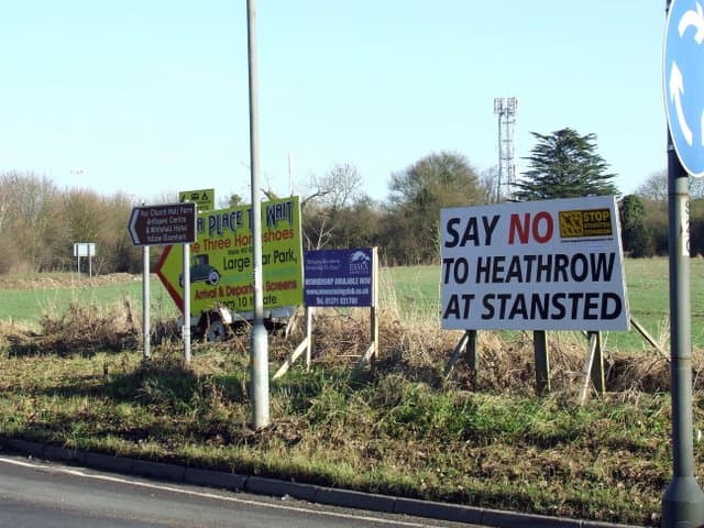 Heathrow Airport terminal bustling with passengers during summer peak travel