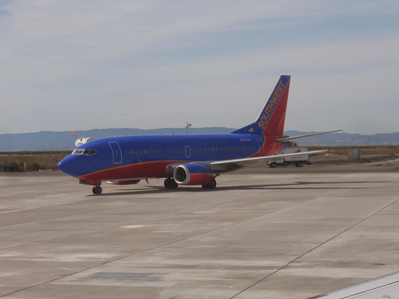 Southwest Airlines plane at Denver International Airport with passengers gathered near the gate