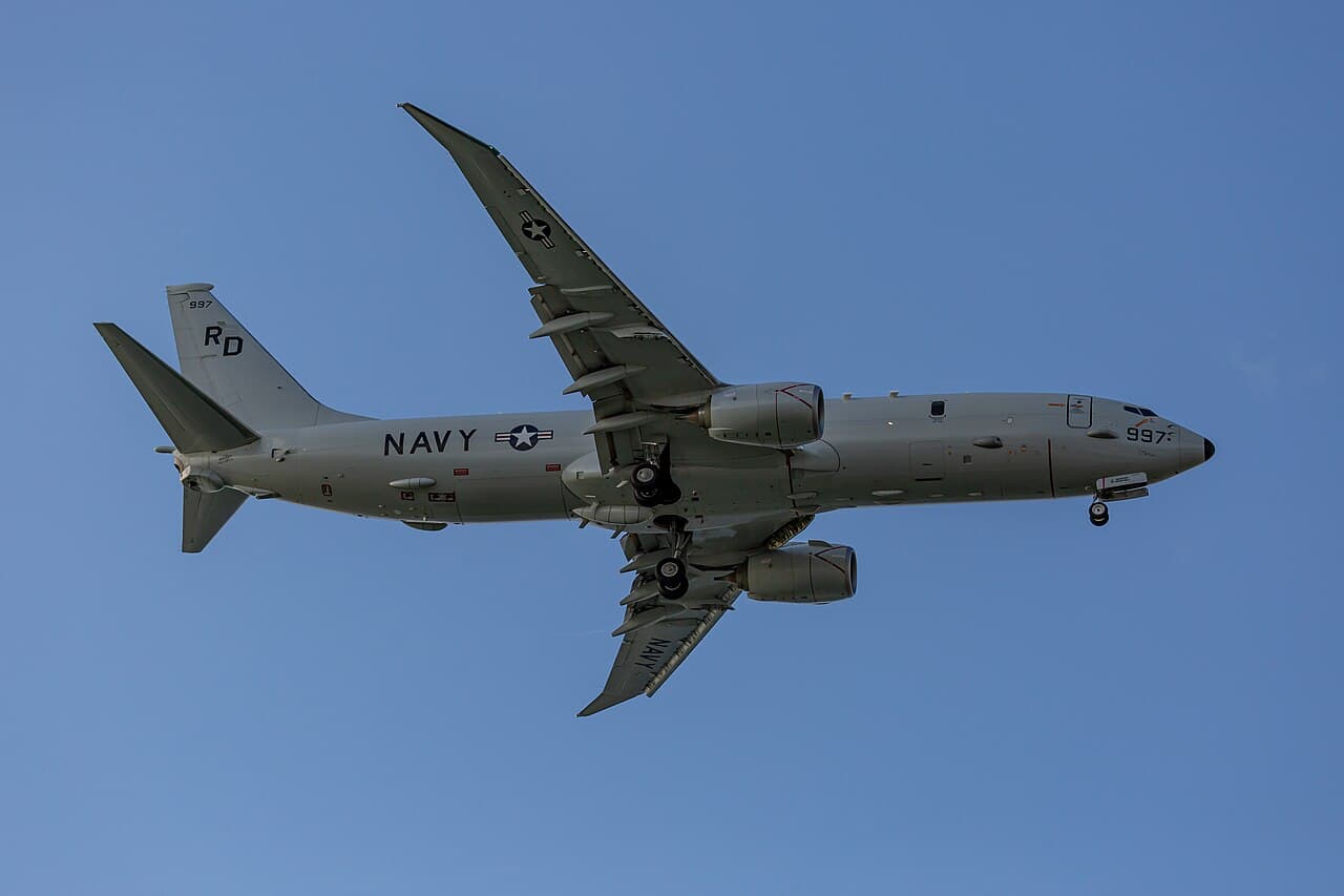 Boeing P-8 Poseidon maritime patrol aircraft in flight over ocean waters