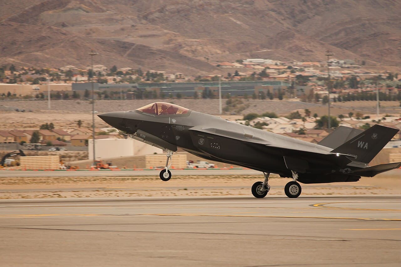 RAF F-35A jet taxiing on runway during daytime at a UK airbase