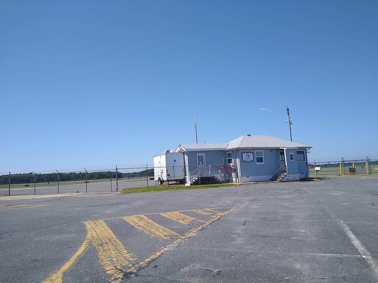 General aviation aircraft at an airport fueling with aviation gasoline pumps