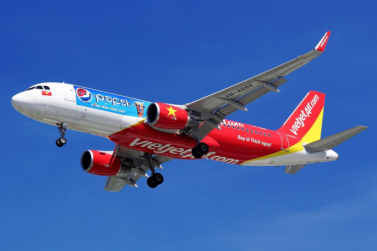 Vietjet aircraft taxiing at an international airport apron during daytime