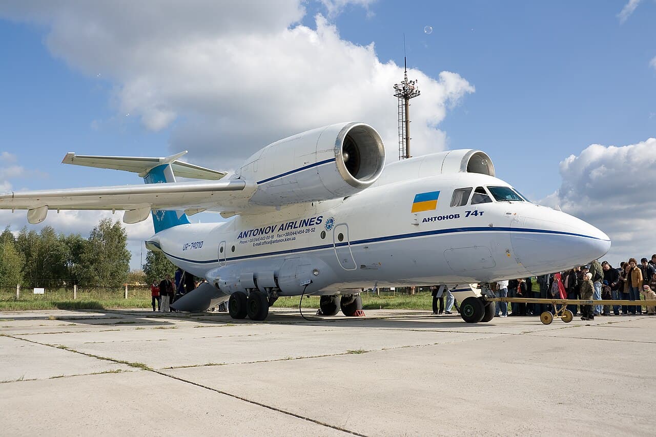 Antonov An-124 large military transport aircraft parked on an airfield apron during daytime